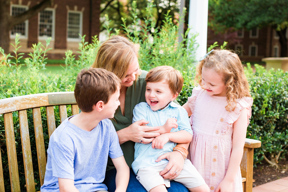 Mom and kids laughing together for family photography session in Dallas.
