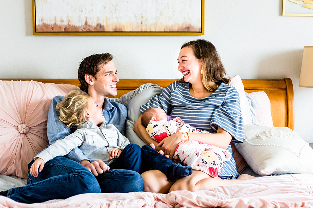 Family bringing baby home deciding how to choose a newborn photographer