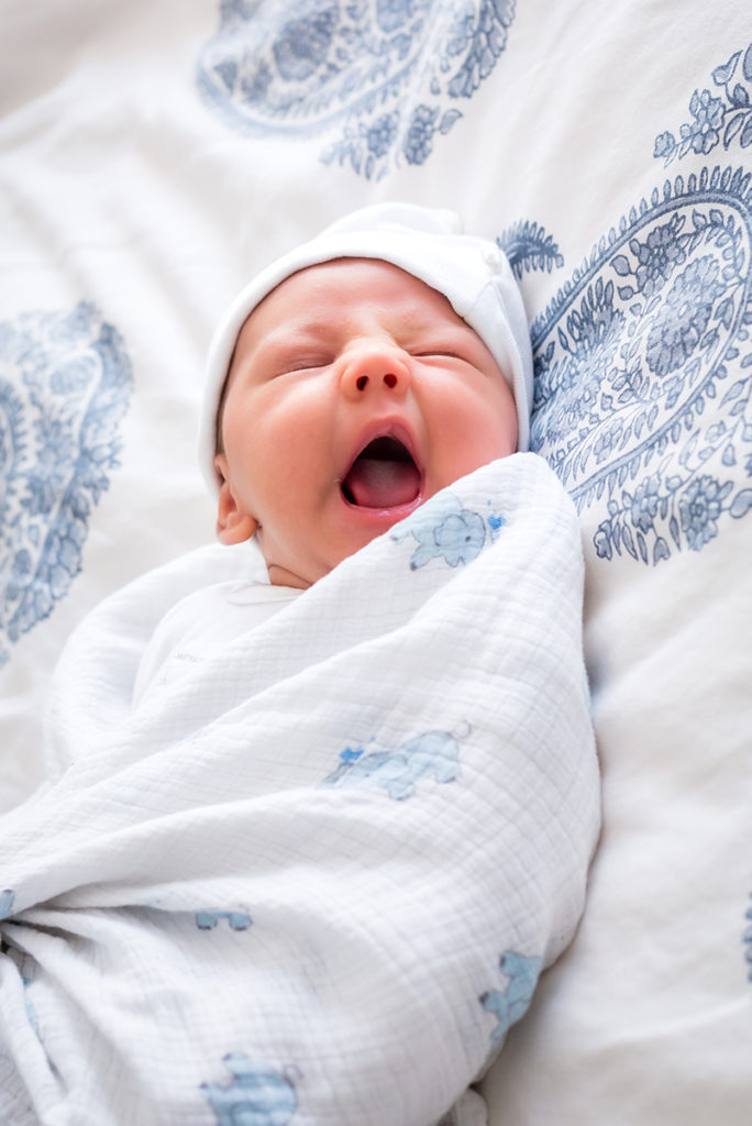Yawning baby photographed by Dallas lifestyle newborn photographer