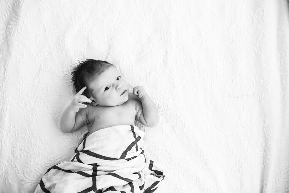 Best Dallas Newborn Photos of 2021 with Baby Laying on Bed